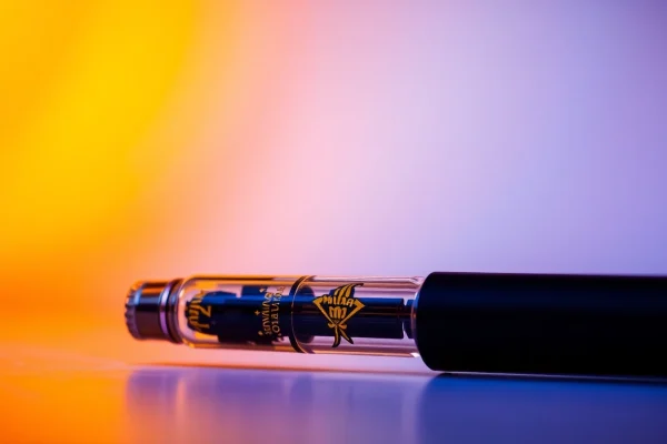 Experience the high-quality Muha Meds 2g live resin disposable vape pen with its sleek design and rich color.